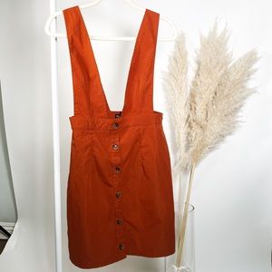 burnt orange suspenders skirt
